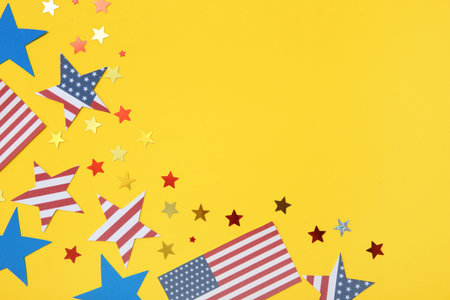USA flags and stars on yellow background. American Independence Day celebration