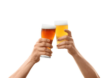 Hands with glasses of beer on white backgroundの写真素材