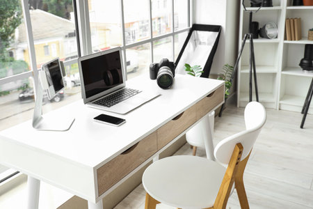 Modern gadgets on photographer's desk in officeの写真素材