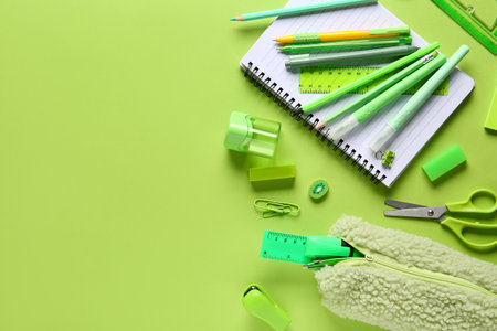 School supplies on green background. Top viewの写真素材