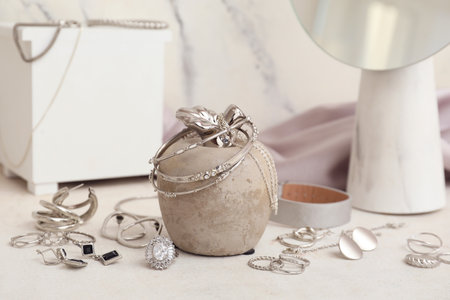 Different stylish jewelery on light background, closeupの写真素材