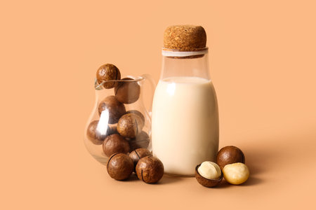 Bottle of fresh macadamia milk on brown backgroundの写真素材