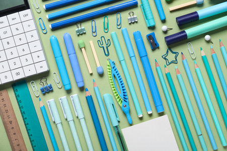 Set of school supplies on green background. Top viewの写真素材
