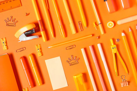 School supplies on orange background. Top viewの写真素材