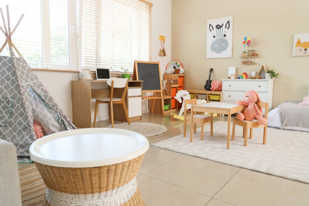 Interior of children's room with tables, shelves and toysの写真素材