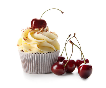 Sweet cherry cupcake and berries on white backgroundの写真素材