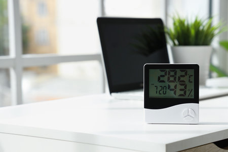 Digital hygrometer on table in office, closeupの写真素材