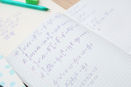 Copybooks with math formulas, closeup
