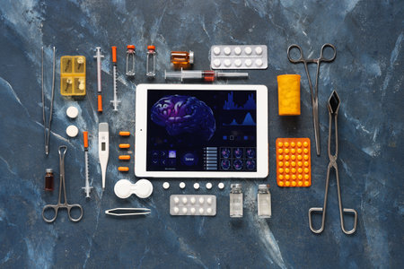 Tablet computer and medical supplies on grunge background. Telemedicine conceptの写真素材