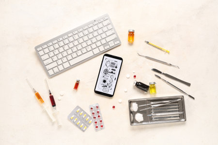 Mobile phone with computer keyboard and medical supplies on light background. Telemedicine conceptの写真素材