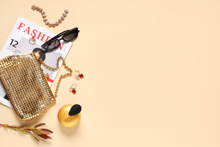 Stylish accessories with bag, earrings and magazine on beige background. Top viewの写真素材