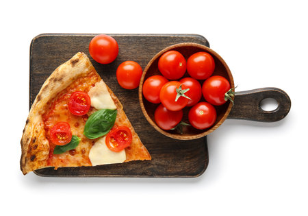 Wooden board with piece of tasty pizza Margarita and tomatoes on white backgroundの写真素材