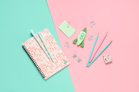 Rocket made of plasticine with stationery on colorful background. Top viewの写真素材