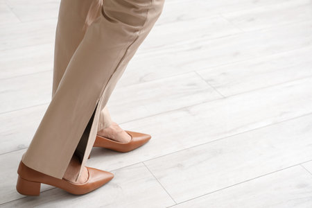 Woman walking on wooden floor. New beginning concept