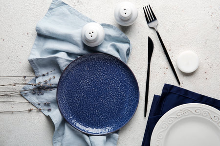 Beautiful table setting with flowers on white backgroundの写真素材