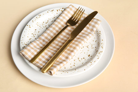 Beautiful table setting on yellow backgroundの写真素材