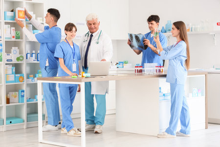 Group of medical students studying with doctor at universityの写真素材