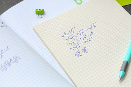 Copybooks with math formulas, closeup