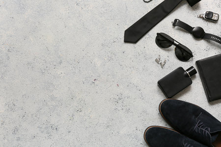 Set of male accessories with sunglasses, perfume and shoes on white grunge background. Top viewの写真素材