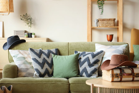 Interior of living room with sofa, table and cowboy hatsの写真素材