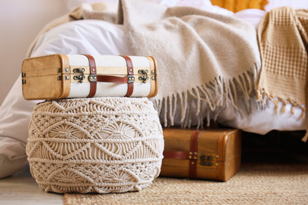 Pouf with suitcases in interior of bedroom. Closeup