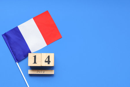 Flag of France and cube calendar with date 14 JULY on blue background. Bastille Day celebrationの写真素材