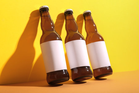 Bottles of cold beer on colorful backgroundの写真素材