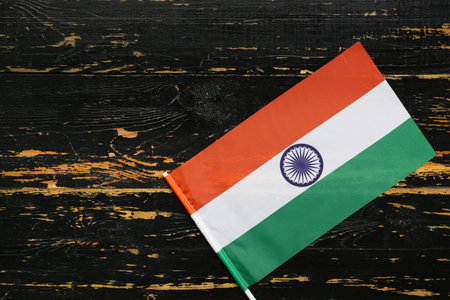 Flag of India on black wooden background