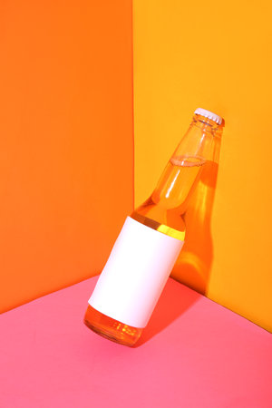 Bottle of cold beer on colorful backgroundの写真素材