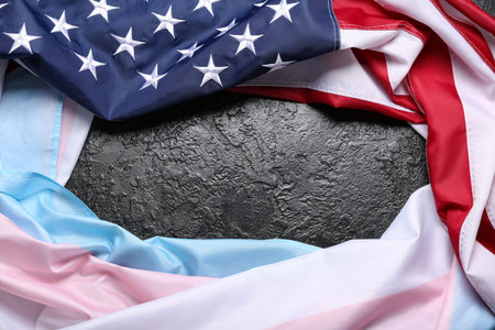 Frame made of transgender and USA flags on black background