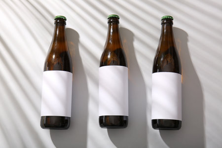 Bottles of cold beer on gray backgroundの写真素材