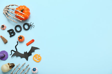 Composition with different decorations for Halloween celebration on color backgroundの写真素材