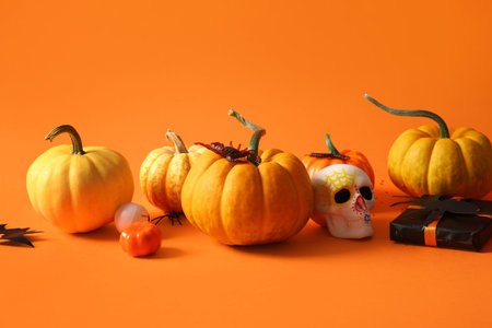 Halloween composition with fresh pumpkins on color backgroundの写真素材
