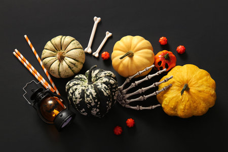 Composition with fresh pumpkins and decorations for Halloween on dark backgroundの写真素材