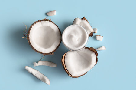 Jar of coconut cosmetic cream on blue backgroundの写真素材