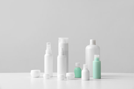 Set of different travel cosmetic products on light tableの写真素材