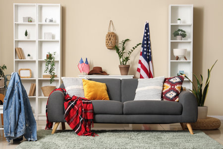USA flags, sofa and racks in interior of living roomの写真素材