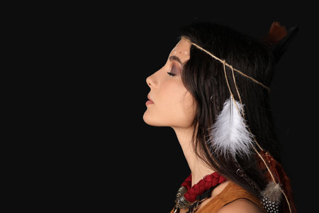 Beautiful female shaman on dark backgroundの写真素材