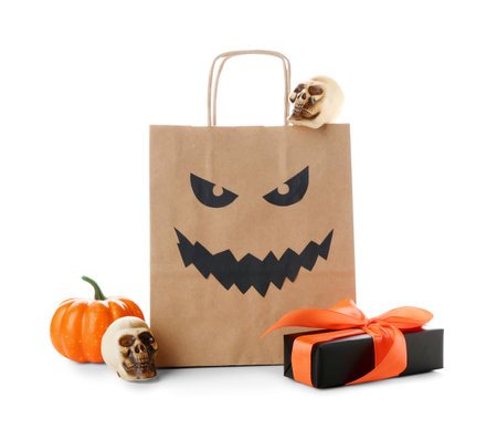 Paper shopping bag, gift box and decorations for Halloween on white backgroundの写真素材