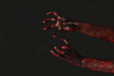 Hands of zombies on black background. Halloween celebrationの写真素材
