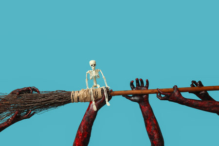 Many hands of zombies with broom and skeleton on blue background. Halloween celebration