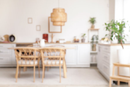 Dining table with chairs in modern kitchen. Blurred viewの写真素材