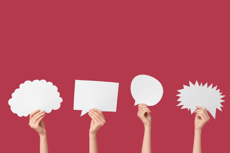 Female hands with different speech bubbles on red background