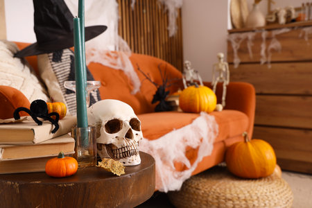 Creepy sofa and coffee table decorated for Halloween celebration in living roomの写真素材
