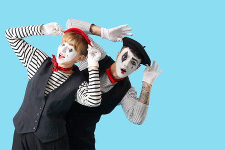 Couple of pantomimists on blue backgroundの写真素材