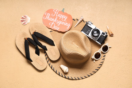 Card for Thanksgiving Day with beach accessories on beige background