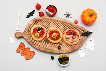 Composition with tasty mini pizzas, ingredients and decorations on gray backgroundの写真素材