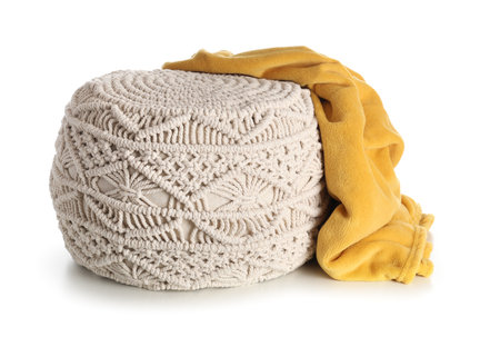 Stylish knitted pouf with plaid on white backgroundの写真素材