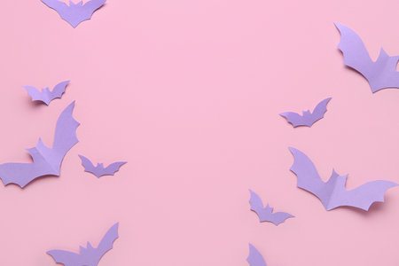 Paper bats for Halloween party on pink backgroundの写真素材