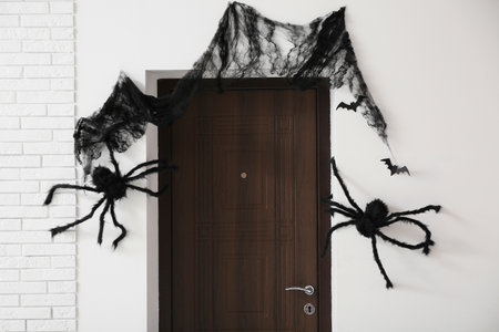 Interior of hall decorated for Halloween with door and spidersの写真素材